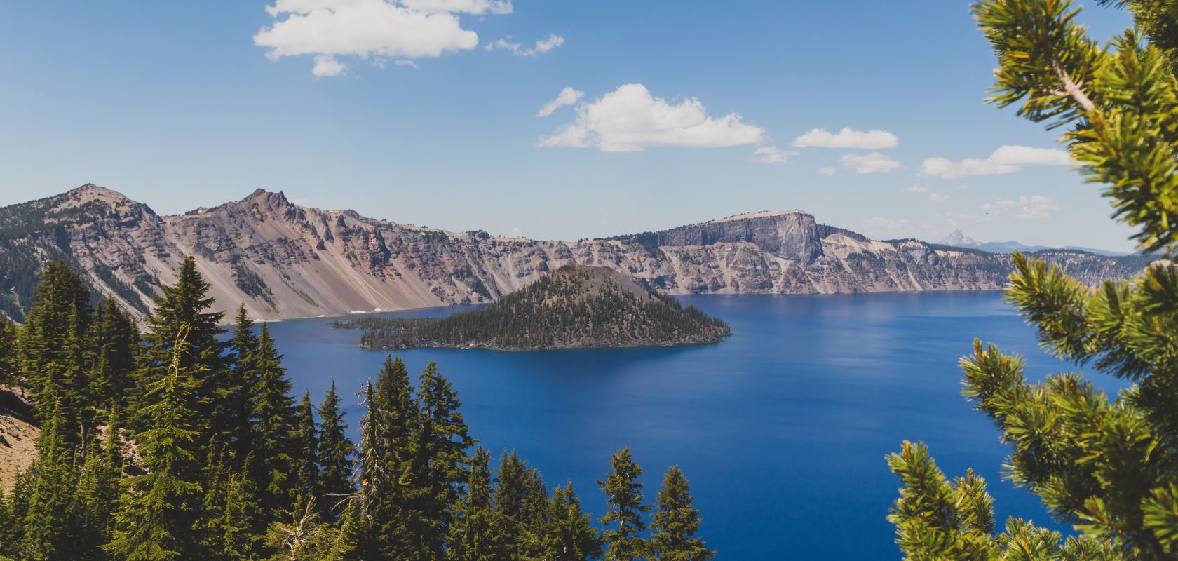 A View Of Crater Lake National Park Surrounded By Forest